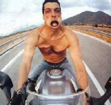rides-a-motorcycle-without-a-helmet-wind-in-your-face.jpg